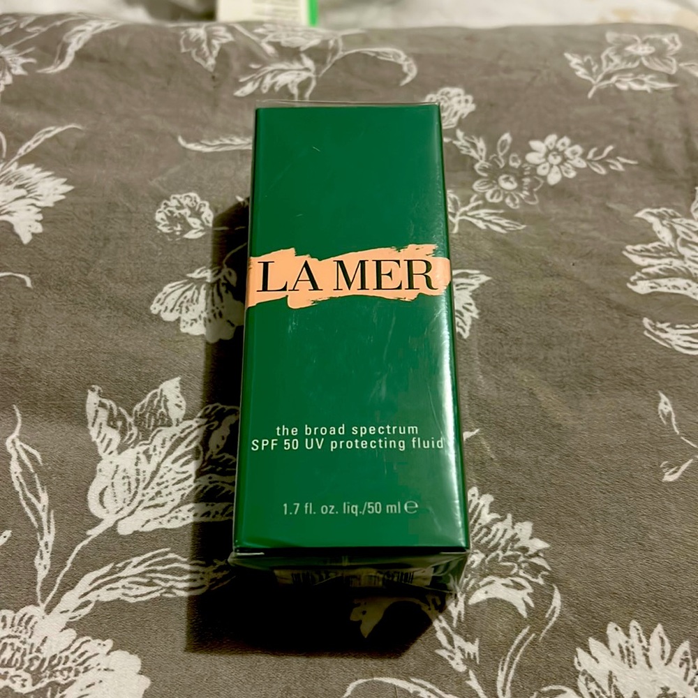 La Mer- mthe broad spectrum SPF 50 UV protecting fluid. Plastic wrapped unopened